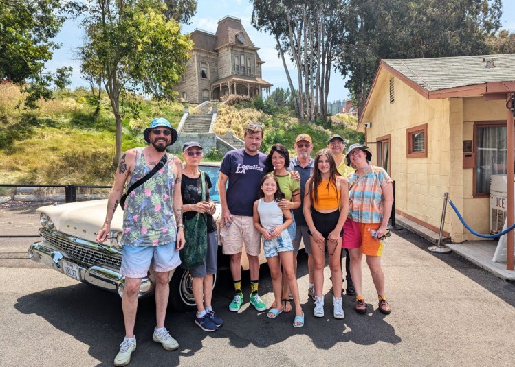 Almost Lee's whole family at Universal Studios posing in front of the Psycho house