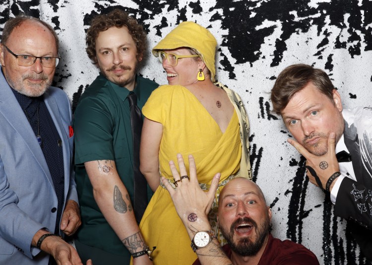 Lee and her 3 brothers and dad, all showing off their new tattoos