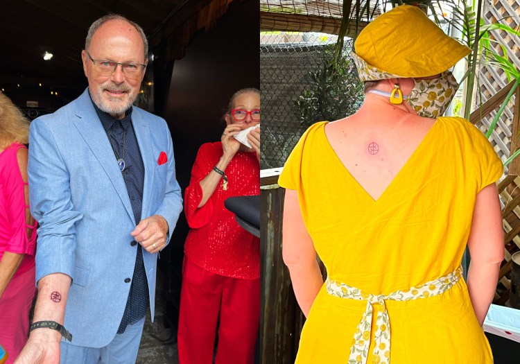 2 photos: Lee's dad and Lee showing off their finished tattoos