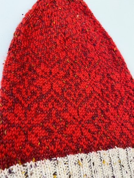 close-up of red-on-red movie hat version laying flat