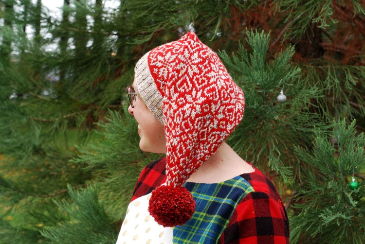 Lee wearing the santa hat with it falling to the side, over the shoulder