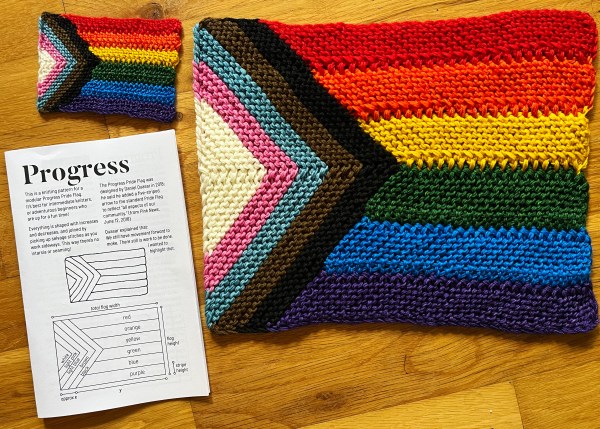two Progress knit flags and a zine style pattern booklet called Progress with a diagram of the pattern