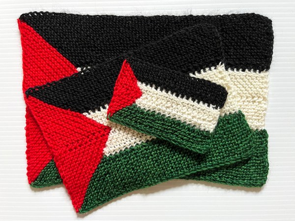three different sizes of Palestinian knit flags stacked up