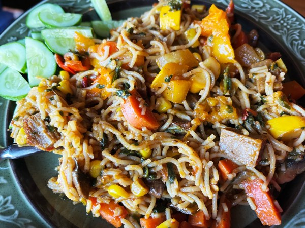 noodles with yellow summer squash, carrots, tomatoes, seitan, and some cucumbers on the side