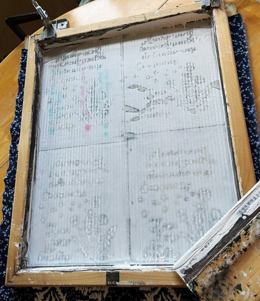 screen with screenprinting ink pulled over it