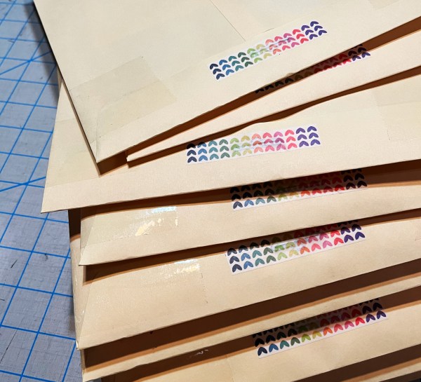 stack of large envelopes with rainbow heart washi tape