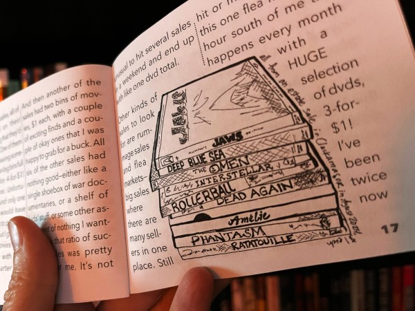 photo of an inside zine spread with text about movie collecting and a drawing of a stack of dvds