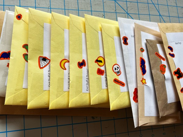 stack of envelopes with vintage halloween stickers