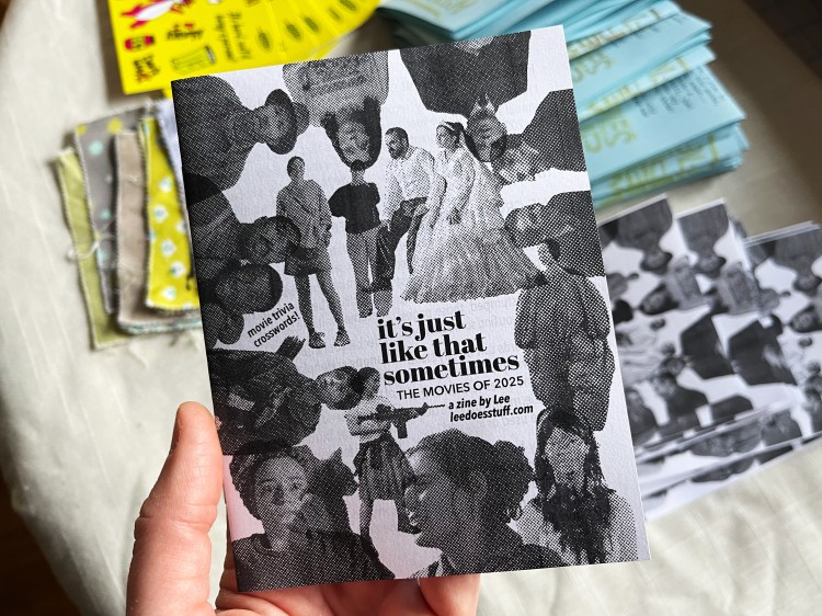 hand holding zine "it's just like that sometimes: the movies of 2025, a zine by Lee leedoesstuff.com"