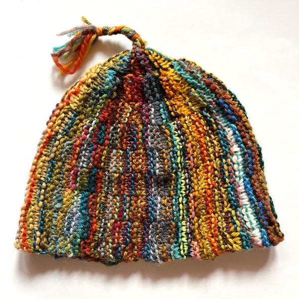 Wowee Zowee hat with scrappy stripes and brain on top, flat