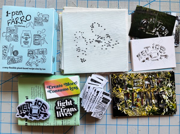 patreon package stuff: 1-pan farro zines, pieces of fabric with connect-the-dots designs, melt ice stencils, i eat plants stencils, mini-zines, stickers (melt ice, create more consume less, fight for trans lives) and green papers with text